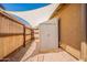 Backyard storage shed and shade sail providing practical storage in a well-maintained outdoor space at 10177 E La Palma Ave, Gold Canyon, AZ 85118