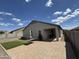 Inviting backyard featuring a covered patio, perfect for relaxing and grilling out with friends at 10736 W Swayback Pass, Peoria, AZ 85383