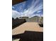 Secluded backyard showcasing a large paved patio with a privacy block fence, ideal for relaxation and entertaining at 10736 W Swayback Pass, Peoria, AZ 85383