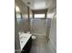 Well-lit bathroom with a shower-tub combination and modern vanity with a neutral tile floor at 10736 W Swayback Pass, Peoria, AZ 85383