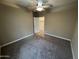 Bedroom with soft carpeting and an attached closet at 10736 W Swayback Pass, Peoria, AZ 85383