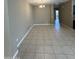 Open concept dining room featuring tile flooring and a modern chandelier at 10736 W Swayback Pass, Peoria, AZ 85383