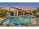 Enjoy this stunning backyard with pool, beautiful landscaping, and covered patio at 10907 E Bella Vista Dr, Scottsdale, AZ 85259