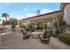 Inviting backyard featuring a pool, patio, a fire pit, and lush landscaping for ultimate outdoor relaxation at 10907 E Bella Vista Dr, Scottsdale, AZ 85259