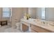 Bright bathroom with a large vanity, neutral tile flooring, and a relaxing ambiance at 10907 E Bella Vista Dr, Scottsdale, AZ 85259