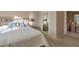 A cozy bedroom featuring carpet floors, natural light, and comfortable furnishings at 10907 E Bella Vista Dr, Scottsdale, AZ 85259