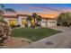 Charming single-story home boasting a well-manicured lawn, a three-car garage, and a tile roof at 10907 E Bella Vista Dr, Scottsdale, AZ 85259