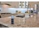Kitchen island details the granite countertops, chrome faucet and a pop-up outlet at 10907 E Bella Vista Dr, Scottsdale, AZ 85259
