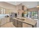 Modern kitchen featuring stainless steel appliances, granite countertops, and open layout at 10907 E Bella Vista Dr, Scottsdale, AZ 85259