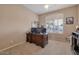Inviting office space with plantation shutters, neutral walls, and ample room for productivity at 10907 E Bella Vista Dr, Scottsdale, AZ 85259