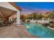 Sparkling pool area with a covered patio, ideal for outdoor entertaining and relaxation at 10907 E Bella Vista Dr, Scottsdale, AZ 85259