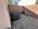 Backyard featuring a modern AC unit with an enclosed rock and brick wall at 11460 W Eden Mckenzie Dr, Surprise, AZ 85378