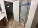 Bathroom shower and vanity as seen from doorway of a bedroom at 11460 W Eden Mckenzie Dr, Surprise, AZ 85378
