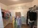 Walk-in closet with rack and shelve storage and dresses at 11460 W Eden Mckenzie Dr, Surprise, AZ 85378