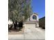 Charming two-story home featuring a two-car garage and well-maintained front yard landscaping at 11460 W Eden Mckenzie Dr, Surprise, AZ 85378