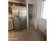 Open pantry and stainless steel fridge at 11460 W Eden Mckenzie Dr, Surprise, AZ 85378