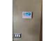 Security system panel and switches on a wall at 11460 W Eden Mckenzie Dr, Surprise, AZ 85378