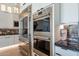 Gourmet kitchen featuring stainless steel appliances including a refrigerator, oven, and microwave at 14141 E Highland Ave, Fountain Hills, AZ 85268