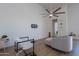 Bright living room with hardwood floors, ceiling fan, stylish furnishings, and modern decor at 14141 E Highland Ave, Fountain Hills, AZ 85268