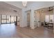 Spacious living room with wood floors adjoins office and kitchen, offering open-concept living at 14141 E Highland Ave, Fountain Hills, AZ 85268