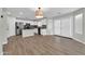 Bright kitchen showcasing stainless steel appliances, white cabinetry, and an adjacent breakfast nook at 14200 W Larkspur Dr, Surprise, AZ 85379
