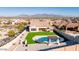 This aerial view showcases a private backyard with pool, pergola, and lush artificial turf at 14552 S 182Nd Dr, Goodyear, AZ 85338