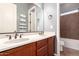 This primary bathroom features double sinks and a spacious shower, ensuring a luxurious and convenient experience at 14552 S 182Nd Dr, Goodyear, AZ 85338