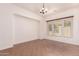 Bright dining room features chandelier lighting and a large window with desert views at 14552 S 182Nd Dr, Goodyear, AZ 85338