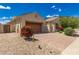 Beautiful home featuring desert landscaping, a brick driveway, and an attached garage at 14552 S 182Nd Dr, Goodyear, AZ 85338