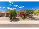 Charming single-story home with desert landscaping and a brick-paved driveway at 14552 S 182Nd Dr, Goodyear, AZ 85338