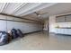 Spacious garage with ample storage cabinets along the walls and epoxy flooring, ready for any project at 14552 S 182Nd Dr, Goodyear, AZ 85338