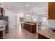 Open-concept kitchen with center island, breakfast bar, and pendant lighting at 14552 S 182Nd Dr, Goodyear, AZ 85338