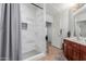 Updated bathroom with a tiled shower and modern fixtures at 14575 W Mountain View Blvd # 11220, Surprise, AZ 85374