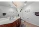 Full bathroom featuring double sinks, vanity, and framed mirrors at 14575 W Mountain View Blvd # 11220, Surprise, AZ 85374