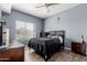 Comfortable bedroom features a ceiling fan and a large window for plenty of natural light at 14575 W Mountain View Blvd # 11220, Surprise, AZ 85374