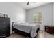 Bedroom with wood-look flooring and a large window with blinds at 14575 W Mountain View Blvd # 11220, Surprise, AZ 85374