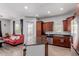 Open floor plan featuring a kitchen with a granite island, stainless steel appliances, and a view of the living room at 14575 W Mountain View Blvd # 11220, Surprise, AZ 85374