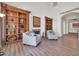 Inviting living room features built-in bookshelves and a cozy fireplace at 14575 W Mountain View Blvd # 11220, Surprise, AZ 85374