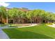 Landscaped green space with pergola-covered seating for outdoor recreation at 14575 W Mountain View Blvd # 11220, Surprise, AZ 85374