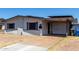 Single-story home with a carport, a brick facade, and dark shutters offering curb appeal at 14823 N 29Th Ave, Phoenix, AZ 85053
