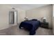 Bedroom features neutral walls, carpeted floor, and doorway to the bathroom at 15407 N 2Nd St, Phoenix, AZ 85022