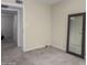 Neutral bedroom features a full length mirror and two doors at 15407 N 2Nd St, Phoenix, AZ 85022