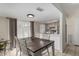 Cozy dining area with modern table set, tile flooring, adjacent to kitchen at 15407 N 2Nd St, Phoenix, AZ 85022