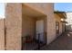 Front entrance featuring a small porch, iron railing, and stucco exterior at 15407 N 2Nd St, Phoenix, AZ 85022
