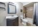 Bright bathroom features a modern vanity and tiled tub-shower combo at 17819 N 46Th Dr, Glendale, AZ 85308