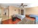 Spacious bedroom with wood floors, ceiling fan, and access to closet at 17819 N 46Th Dr, Glendale, AZ 85308
