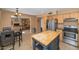 Large eat-in kitchen with maple cabinetry, tile flooring, and direct view to living room at 17819 N 46Th Dr, Glendale, AZ 85308