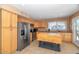 Spacious kitchen with stainless steel appliances, tile flooring, and a center island at 17819 N 46Th Dr, Glendale, AZ 85308