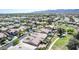 An elevated view showcases the community's layout with homes and some backyard pools in a desert community at 18072 W Paradise Ln, Surprise, AZ 85388