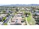 Overhead view of lovely community with manicured landscapes, mountains, and stunning views at 18072 W Paradise Ln, Surprise, AZ 85388